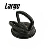 A black heavy-duty suction cup dent puller tool.