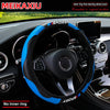 Blue and black carbon fiber steering wheel cover for a car, shown inside the vehicle cockpit.