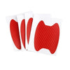 A pack of four red carbon fiber film protectors for car door handles.