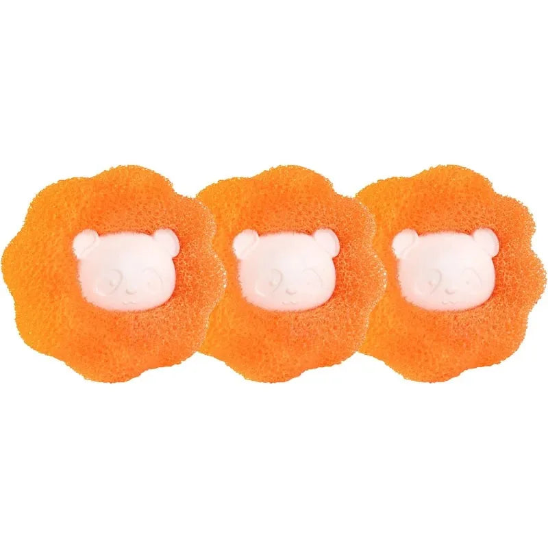 Three bright orange reusable laundry balls designed for pet hair and lint removal