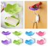 A set of colorful two-tier bathroom storage racks for holding and draining various items like soap and bath accessories.
