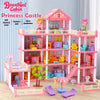 A pink princess castle dollhouse with multiple floors and accessories for play