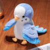 A soft blue and white plush parrot hand puppet toy with yellow feet and a beak.