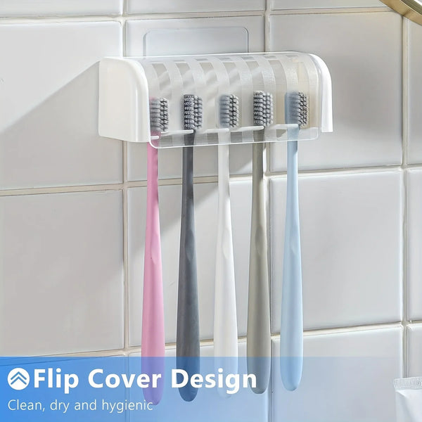Klares Silikon-Flip-Cover-Zahnbürstenhalter mit fünf Zahnbürsten an einer weißen Fliesenwand.