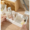 A white expandable vanity cosmetic organizer filled with various skincare products and bottles.