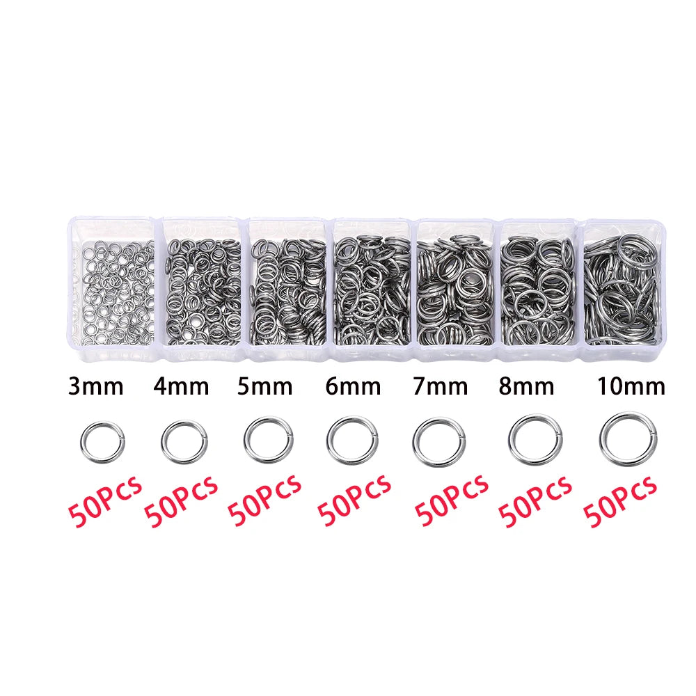 A set of silver jewelry making components including lobster clasps, jump rings, and crimps in various sizes.