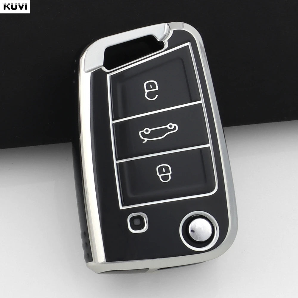 A close-up view of a silver car key cover with multiple buttons and a rotating mechanism.