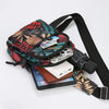 A patterned leaf print sling crossbody bag with multiple pockets and a black strap, next to an iPad.