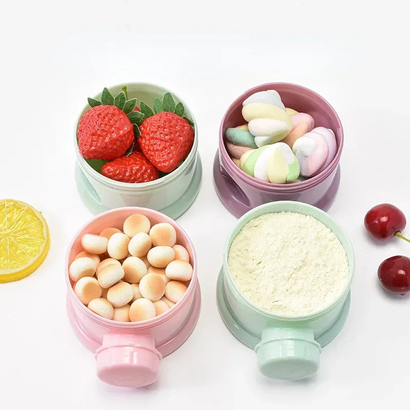 Pink and green bear-shaped baby food storage containers filled with various fruit and vegetable purees