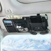 A black car sun visor organizer with multiple pockets for storing cash, cards, and sunglasses is shown in a vehicle interior.