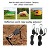 A close-up of reflective wind rope pulley adjusters and hooks used for tensioning camping tents.