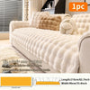 A beige plush anti-slip sofa cushion cover with decorative fluffy accents shown on a sofa.