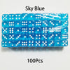 A row of 100 sky blue acrylic dice in a plastic case.