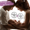 A mother and father lovingly look at their newborn baby while holding a double-sided decision coin for new parents.