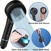 A black handheld shower head with removable silicone nozzles and a water stop button is shown in various modes.