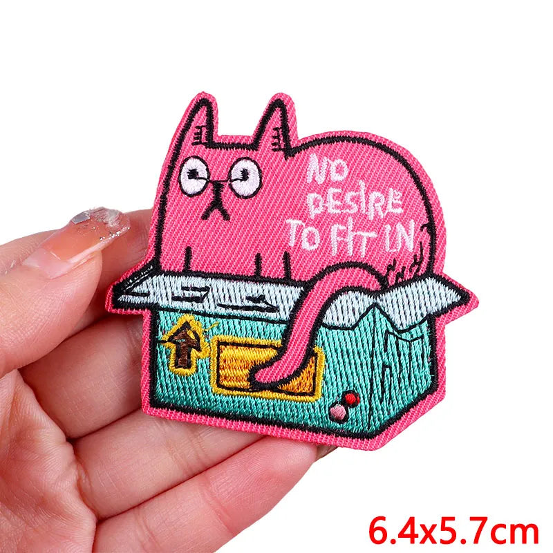 Pink cartoon cat embroidery patch with a distressed look and an iron-on backing