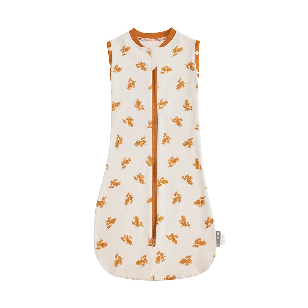 A cream-colored baby sleep sack with orange floral embroidery and a collar.