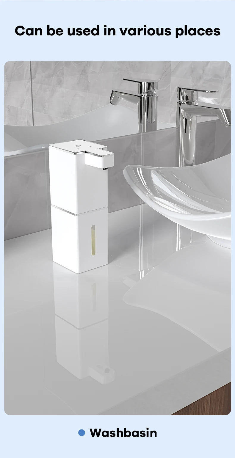 A white touchless infrared smart soap dispenser is shown on a bathroom counter next to a sink.