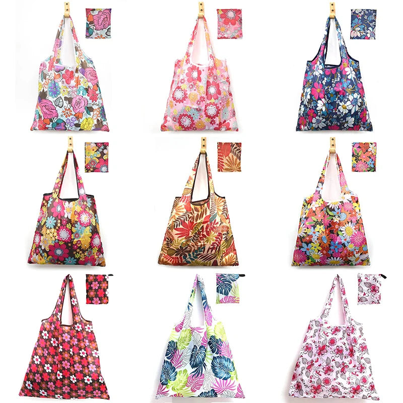 A collection of colorful floral print reusable shopping totes and carry pouches in various shades.