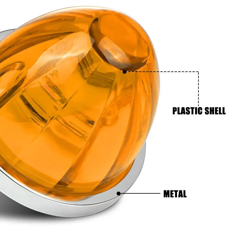 Close-up view of an orange plastic shell with a metal base, showing the watermelon LED marker and turn signal lights.