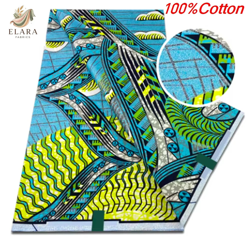 Blue and green African wax print fabric featuring abstract patterns on a textile roll.
