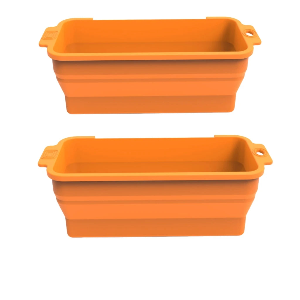 An orange reusable silicone grease liner for a griddle pan.