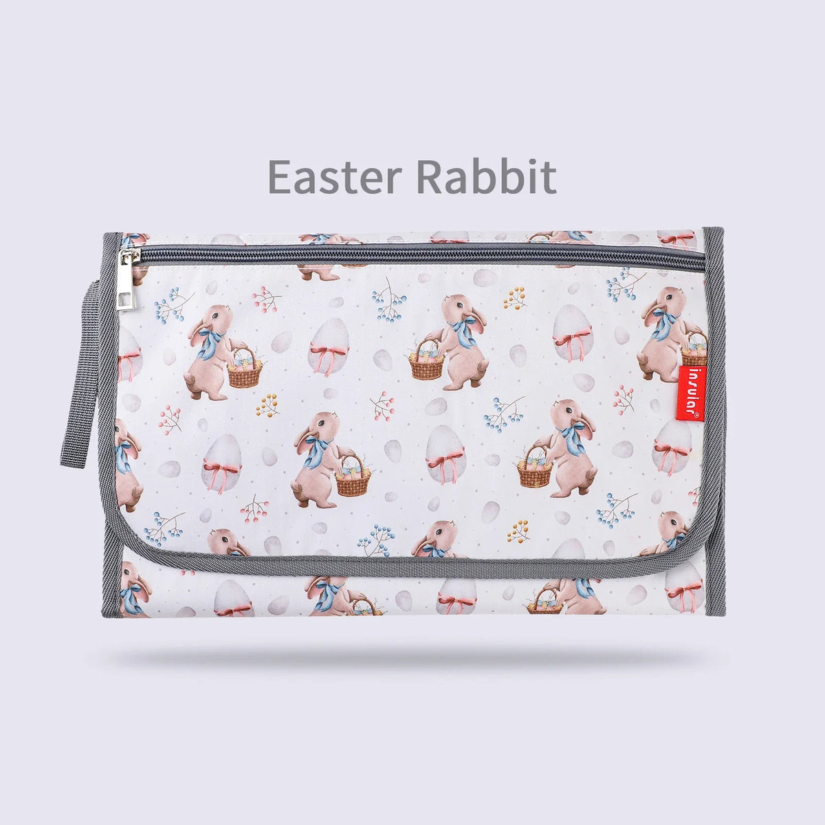 A zippered storage bag for an Easter rabbit themed foldable baby changing mat.