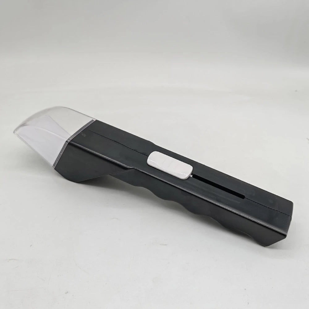A black handheld insect catcher with a silver transparent head and telescopic handle.