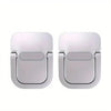 A pair of silver aluminum laptop risers with adhesive mounting pads.