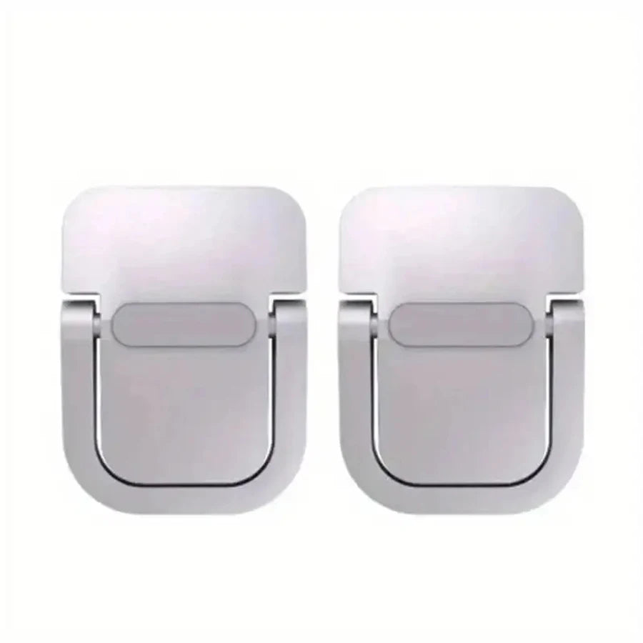 A pair of silver aluminum laptop risers with adhesive mounting pads.