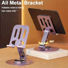 A metal bracket phone stand is shown rotating 360 degrees on a wooden surface.
