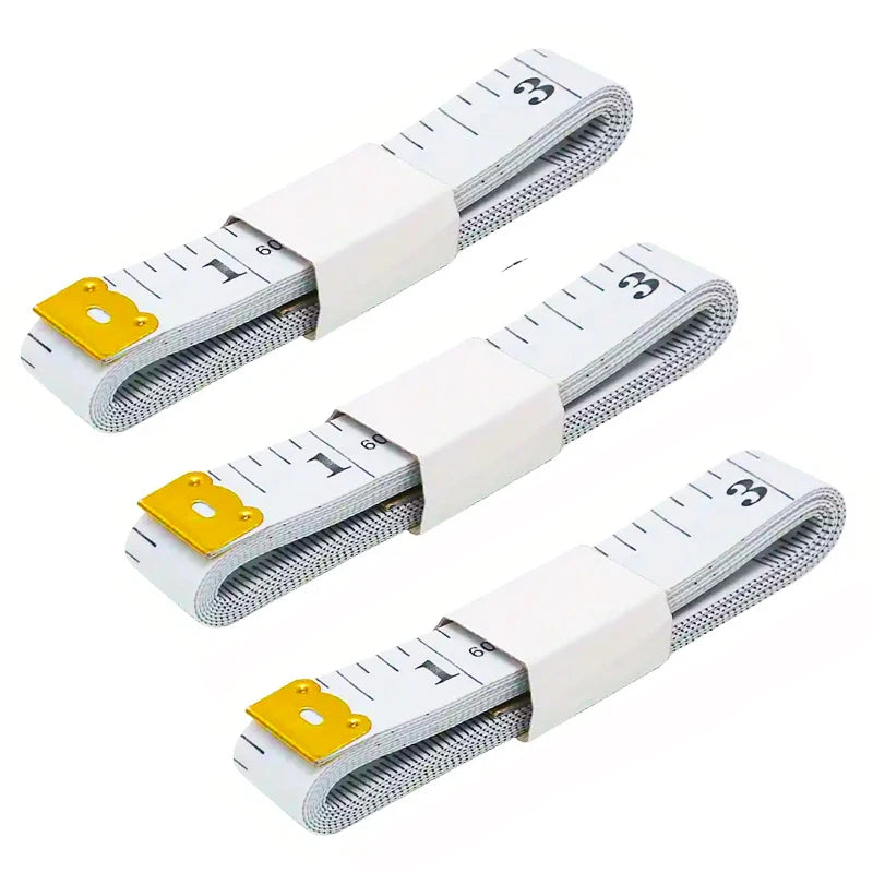 A flexible soft tape measure with dual-sided markings and a white and gray design is shown in multiple orientations.