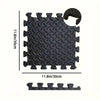 Black interlocking EVA foam exercise mat with textured surface and grip features.