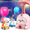 Pink balloon-powered racing car toy with an air pump and various colored balloons