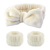 A white, fluffy wrist washing band or cuff made of absorbent microfiber.