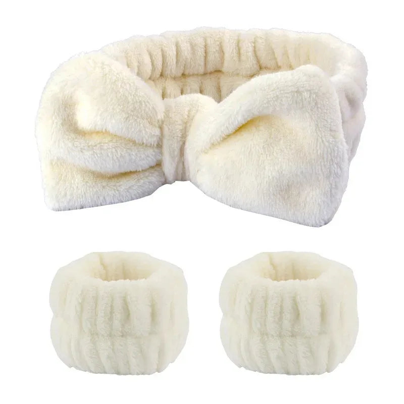 A white, fluffy wrist washing band or cuff made of absorbent microfiber.