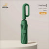 A forest green automatic folding umbrella with a lightweight design shown standing on a white surface.