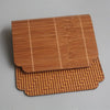 A rectangular bamboo tea mat with woven texture and heat insulation features parallel lines.