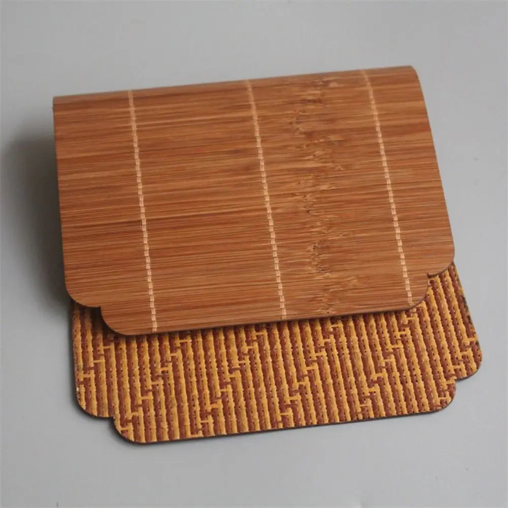 A rectangular bamboo tea mat with woven texture and heat insulation features parallel lines.