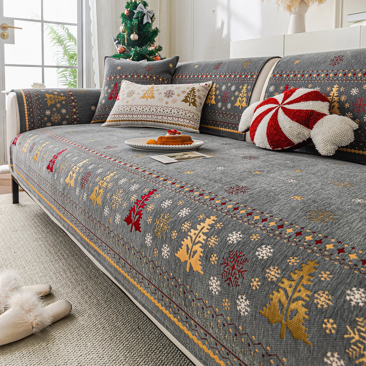 Gray sofa covers decorated with gold and white Christmas patterns, featuring festive accents.