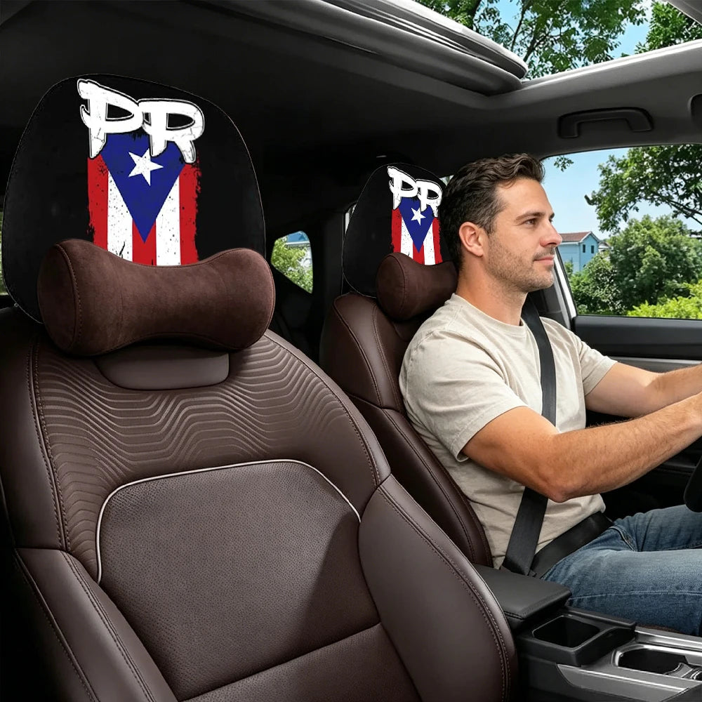 Two brown car headrest covers with a patriotic design are visible in the interior of a car.