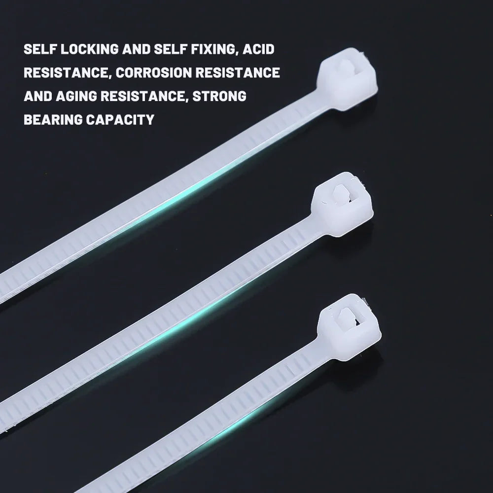 Three white nylon self-locking cable ties with plastic fixing mechanisms shown against a dark background.