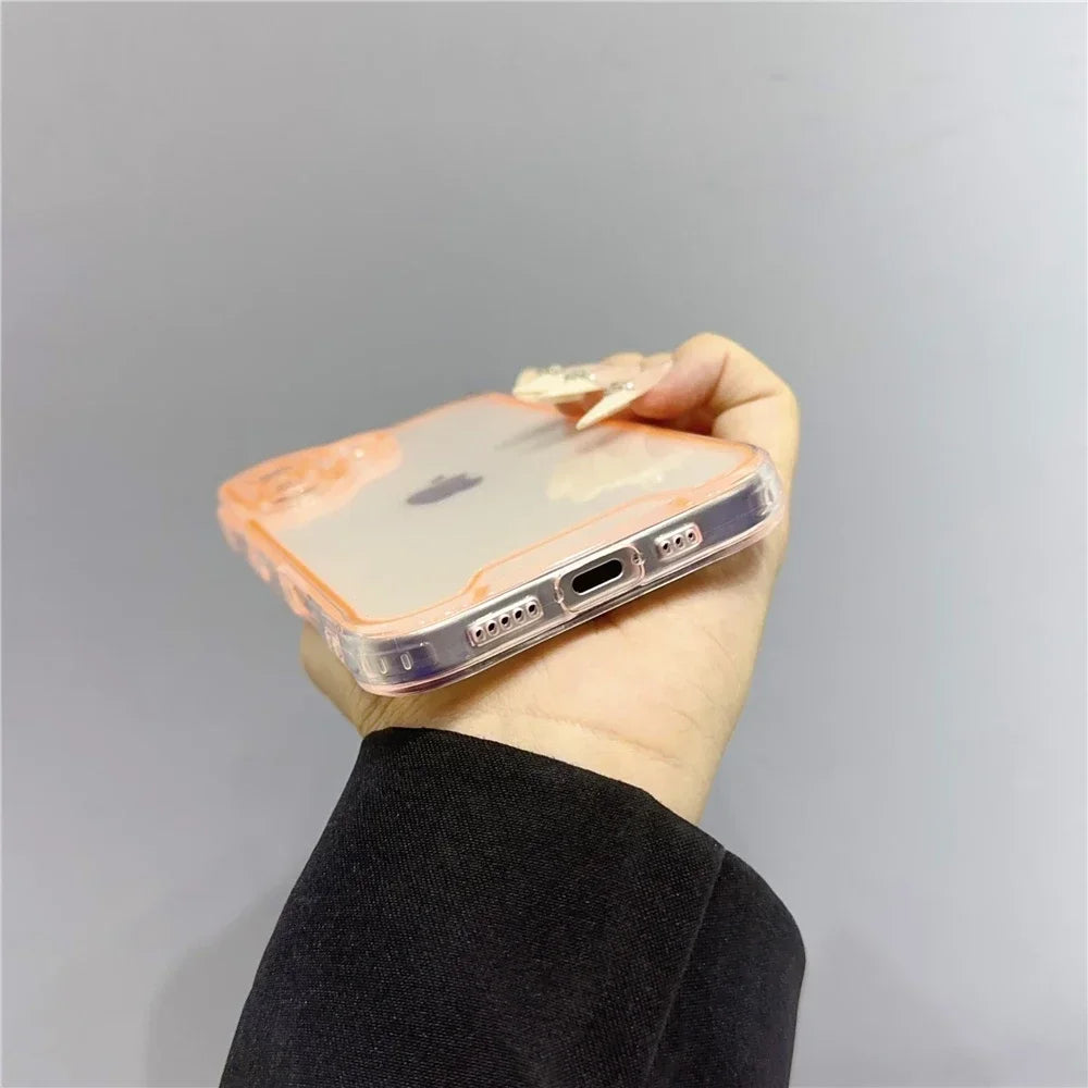 A hand holds an iPhone in a clear glow-in-the-dark neon case against a light gray background.