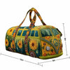 A quilted travel duffle bag featuring a yellow and green floral pattern with 3D stitching.