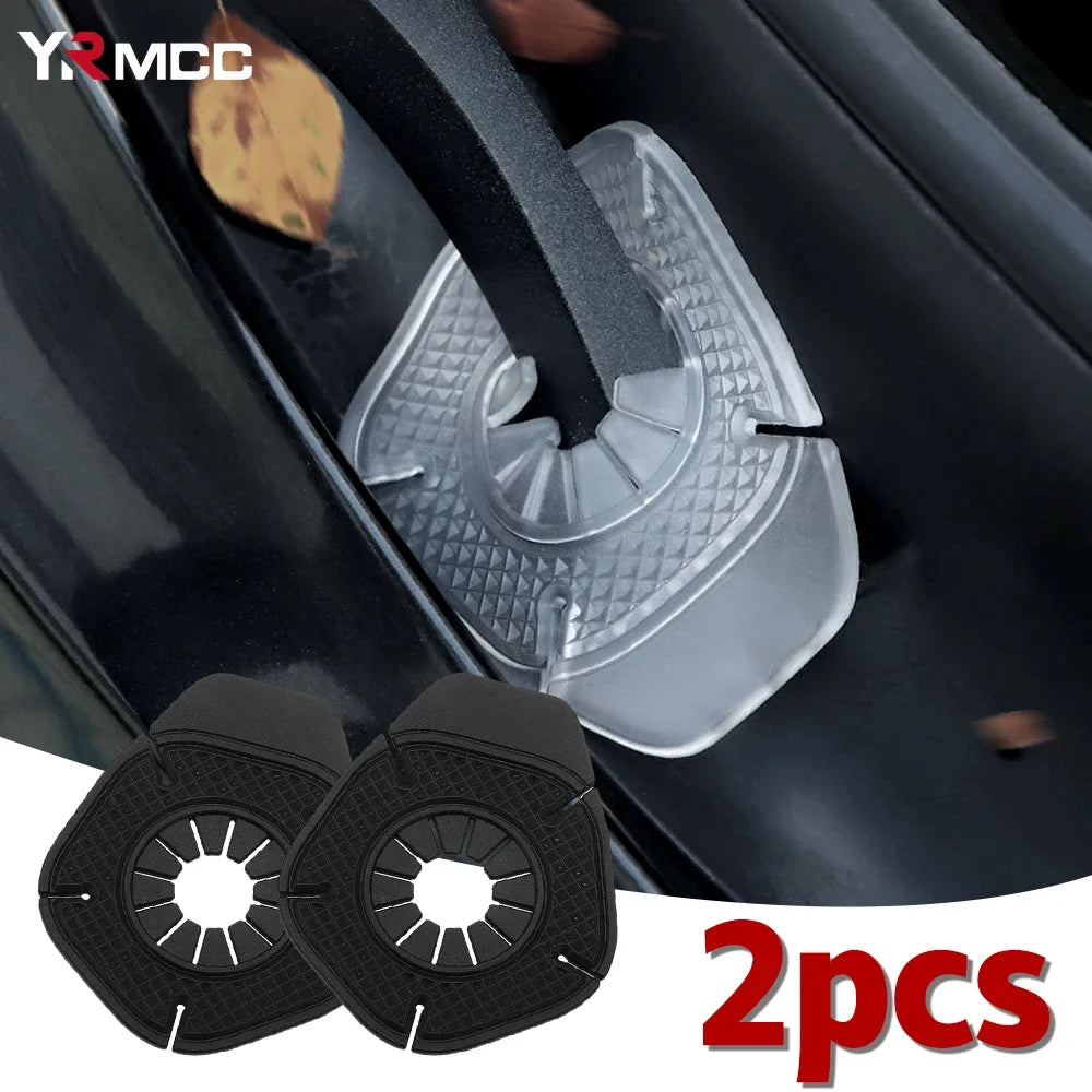 Two clear plastic covers designed to protect the windshield wiper hole on a car, shown against a dark surface.