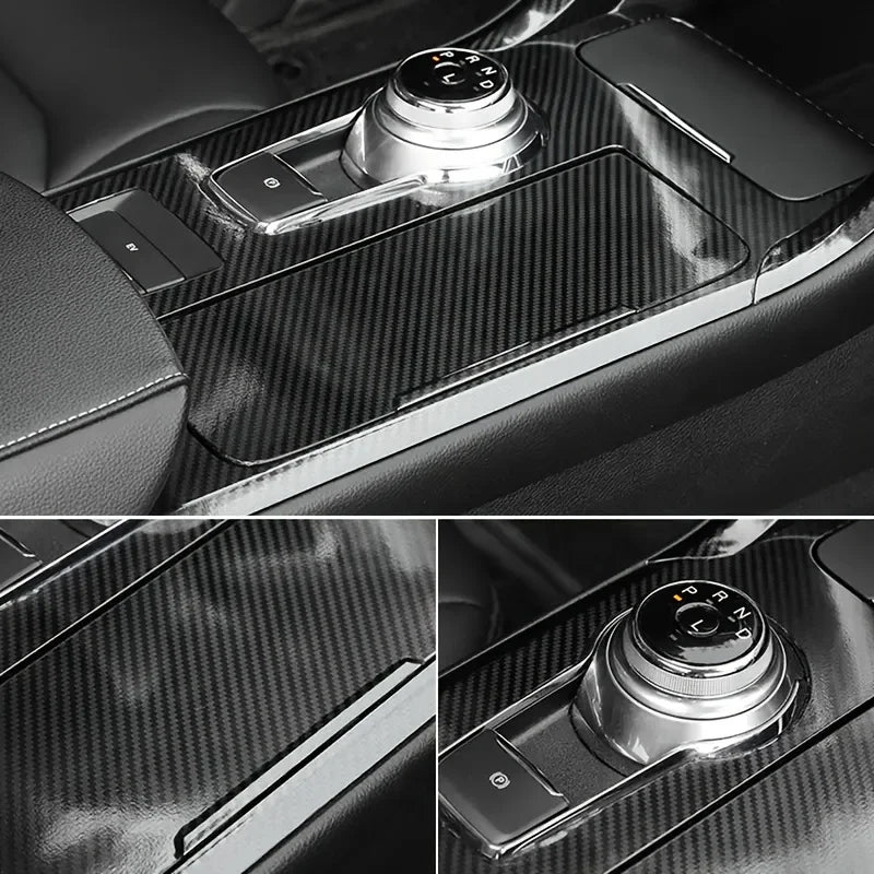 Close-up view of a car interior panel showing a carbon fiber vinyl wrap film and an electronic control knob.