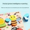 A wooden jigsaw puzzle featuring a bee and other animals for children's learning.