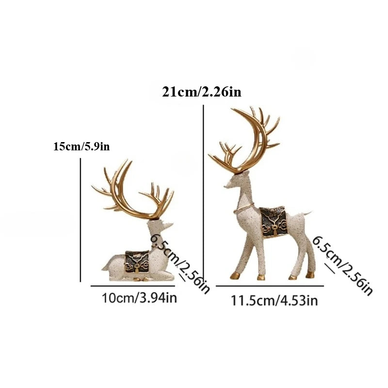 A set of two resin deer figurines, one standing and one lying down, used for Christmas or home decor.