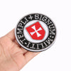 Embroidered patch featuring a red cross shield design with black and white text on a circular backing