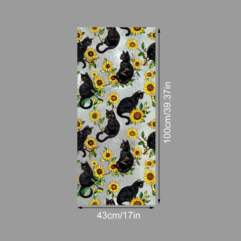 A vertical sheet of floral stained glass window film featuring black cats and yellow flowers on a light background.